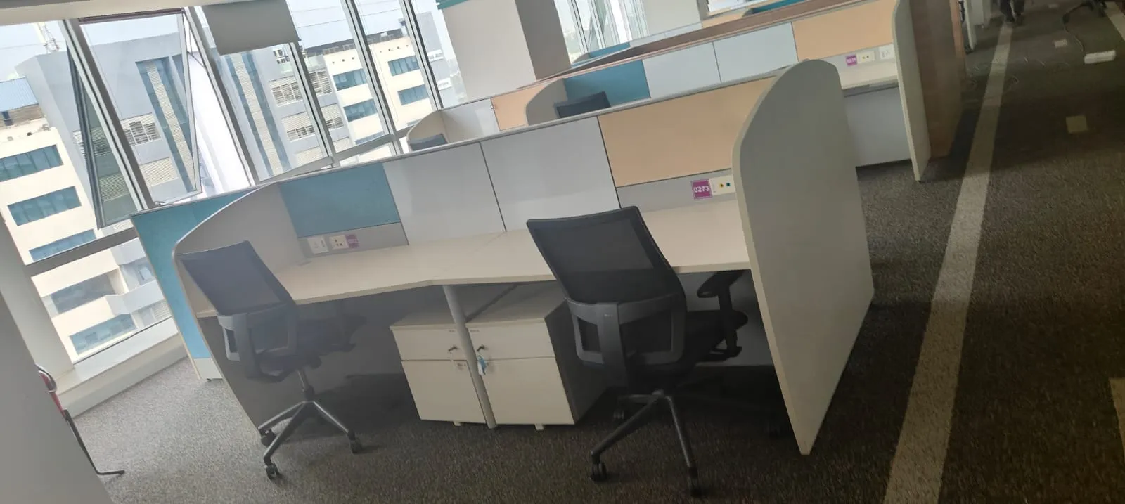 Mid-century modular executive layout with rolling office chairs ready for corporate office dismantling Bellandur clearouts
